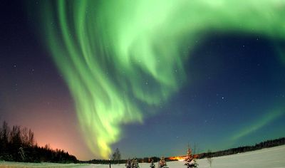 Aurora borealis. Northern lights over Bear Lake, Eielson Air Force Base, Alaska.